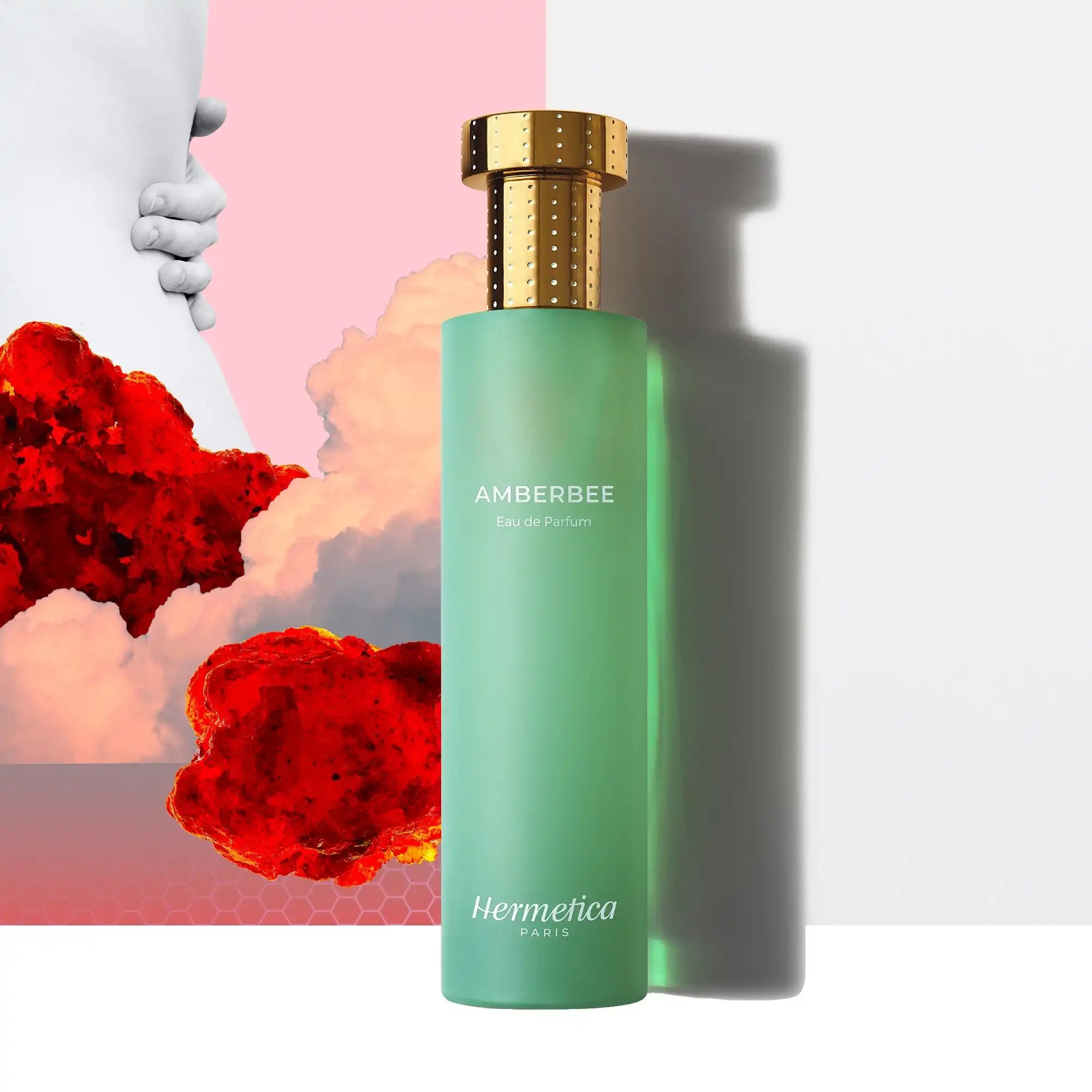 Mint green perfume bottle with a gold cap.